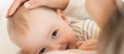 mom touching head of the baby